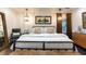 Inviting main bedroom with a metal bed frame, wooden bench, and elegant decor at 446 Piney Croft Ln, Maitland, FL 32751