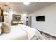 Cozy main bedroom with a TV, artwork, and light colored walls, providing a relaxing retreat at 446 Piney Croft Ln, Maitland, FL 32751