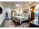 Serene main bedroom with a large bed, pendant lighting, and a view to an adjacent room at 446 Piney Croft Ln, Maitland, FL 32751