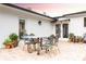An outdoor patio with patio furniture, offering a stylish space for relaxation and dining at 446 Piney Croft Ln, Maitland, FL 32751
