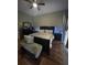 Serene bedroom with dark furniture, plush textiles and a ceiling fan for added comfort at 447 Cadiz Loop, Davenport, FL 33837