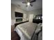 Bedrooms showcases a sleek fireplace, mounted TV, and stylish decor for a cozy retreat at 447 Cadiz Loop, Davenport, FL 33837