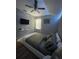 Inviting bedroom with hardwood floors, ceiling fan, and mounted television at 447 Cadiz Loop, Davenport, FL 33837