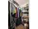 Walk-in closet featuring shelving, rods, and ample storage space at 447 Cadiz Loop, Davenport, FL 33837