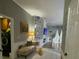 Stylish hallway offers a seating area, accent wall, and decorative elements for a warm welcome at 447 Cadiz Loop, Davenport, FL 33837