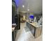 The gourmet kitchen showcases premium appliances, ample counter space, and seamless connectivity to the adjacent living area at 447 Cadiz Loop, Davenport, FL 33837