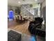 Expansive living room with dining area and stylish staircase, perfect for entertaining at 447 Cadiz Loop, Davenport, FL 33837