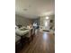 The open-concept design allows for seamless flow between the living, dining, and entry areas with natural light at 447 Cadiz Loop, Davenport, FL 33837