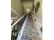 Striking staircase showcases stylish carpeting and decorative wall accents at 447 Cadiz Loop, Davenport, FL 33837