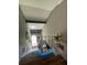 View of the home stairway and entry window with colored carpet and lighted stairs at 447 Cadiz Loop, Davenport, FL 33837