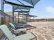 Lounge chairs and umbrellas in the community pool area offering a relaxing space for residents at 4997 Kaia Ave, Winter Haven, FL 33884