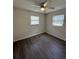 A modern bedroom with hard wood floors and ceiling fan at 5123 Turnbull Dr, Orlando, FL 32812