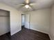 A modest bedroom featuring a ceiling fan, fresh paint, and a closet at 5123 Turnbull Dr, Orlando, FL 32812