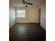 Sunlit living room with neutral walls and plank floors at 5123 Turnbull Dr, Orlando, FL 32812