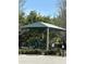 Neighborhood playground area with green sunshade and parking at 5123 Turnbull Dr, Orlando, FL 32812