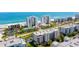 Stunning aerial view of beachfront condos with ocean views and manicured grounds near the sunny coastline at 5300 S Atlantic Ave # 6-502, New Smyrna Beach, FL 32169