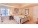 Comfortable bedroom with a cozy bed, side table, and natural light creates a welcoming and restful space at 5300 S Atlantic Ave # 6-502, New Smyrna Beach, FL 32169