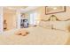 Bedroom featuring a work space, soft lighting, a comfortable bed, and neutral-toned walls at 5300 S Atlantic Ave # 6-502, New Smyrna Beach, FL 32169
