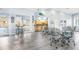 Common room area featuring seating, a bar area with kitchen, and pool views at 5300 S Atlantic Ave # 6-502, New Smyrna Beach, FL 32169