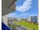 Great view of the condo complex, with manicured landscaping, parking, and beautiful surrounding buildings at 5300 S Atlantic Ave # 6-502, New Smyrna Beach, FL 32169