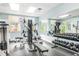 Bright gym featuring various exercise machines, free weights, and a mirrored wall at 5300 S Atlantic Ave # 6-502, New Smyrna Beach, FL 32169
