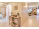 Inviting hallway featuring stylish decor leading to the living area and bedroom, creating a warm ambiance at 5300 S Atlantic Ave # 6-502, New Smyrna Beach, FL 32169