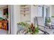 Lanai with a decorative signpost and an outdoor seating area surrounded by lush plants at 5300 S Atlantic Ave # 6-502, New Smyrna Beach, FL 32169