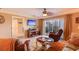 Cozy living room with a comfortable seating area, television, and access to a balcony provides a relaxing retreat at 5300 S Atlantic Ave # 6-502, New Smyrna Beach, FL 32169