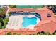 Aerial view of a unique shaped pool with lounge chairs and covered seating area at 5300 S Atlantic Ave # 6-502, New Smyrna Beach, FL 32169