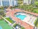Aerial view of a luxurious community pool with covered seating areas, perfect for relaxation and recreation at 5300 S Atlantic Ave # 6-502, New Smyrna Beach, FL 32169