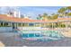 The community pool area features a spacious pool, lounge area, and nearby palm trees at 5300 S Atlantic Ave # 6-502, New Smyrna Beach, FL 32169