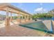 Outdoor recreation area featuring covered lounge seating and bocce ball court at 5300 S Atlantic Ave # 6-502, New Smyrna Beach, FL 32169