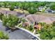 An aerial view showcases the community's well-manicured landscaping, sidewalks and various architectural styles at 5464 Factors Walk Dr, Sanford, FL 32771