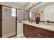 Spacious bathroom featuring a glass-enclosed shower and a double vanity at 5464 Factors Walk Dr, Sanford, FL 32771
