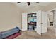 Versatile room featuring an open closet converted to a home office nook with bonus bench at 5464 Factors Walk Dr, Sanford, FL 32771