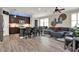 Open-concept living area with modern furnishings and natural light at 5464 Factors Walk Dr, Sanford, FL 32771