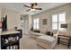 Comfortable living room featuring a sectional sofa, plantation shutters, and neutral color palette at 5464 Factors Walk Dr, Sanford, FL 32771