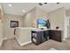 Cozy loft featuring a TV and snack bar area with modern finishes and decor at 5464 Factors Walk Dr, Sanford, FL 32771
