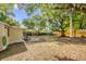 Expansive backyard featuring lots of shade, a large tree, outdoor gym, and above-ground spa at 5750 Delta St, Orlando, FL 32807