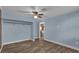 Bedroom featuring closet, wood-look flooring, and neutral paint at 5750 Delta St, Orlando, FL 32807