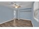 Spacious bedroom with wood-look flooring, closet, and neutral paint at 5750 Delta St, Orlando, FL 32807
