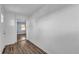 Clean foyer with wood-look floors and white walls leading to other rooms at 5750 Delta St, Orlando, FL 32807
