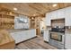 Charming kitchen with white cabinets, stainless steel range, and granite countertops at 5750 Delta St, Orlando, FL 32807