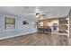 Open-concept living room, featuring a kitchen bar and plenty of space for entertaining at 5750 Delta St, Orlando, FL 32807