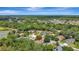 Expansive aerial view of a well-maintained home in a leafy neighborhood, close to a tranquil lake at 626 Green Rock Ct, Apopka, FL 32712