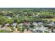 An aerial view of the neighborhood featuring the home nestled among lush trees at 626 Green Rock Ct, Apopka, FL 32712