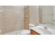 A full bathroom with a sink, toilet, and tiled shower at 626 Green Rock Ct, Apopka, FL 32712