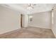 A large bedroom featuring neutral colored walls and neutral colored carpeting at 626 Green Rock Ct, Apopka, FL 32712