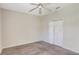 Bedroom featuring plush carpet, bi-fold closet doors and a ceiling fan at 626 Green Rock Ct, Apopka, FL 32712