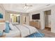 Bedroom with bed and wooden dresser and TV at 626 Green Rock Ct, Apopka, FL 32712